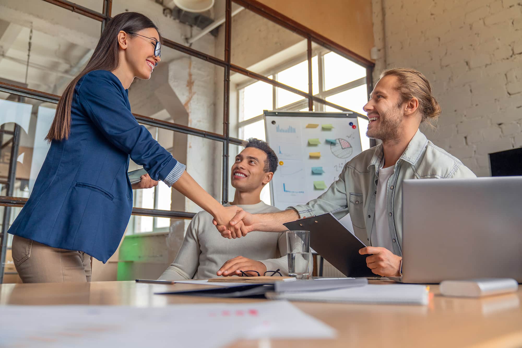 Business people closing a deal with a handshake