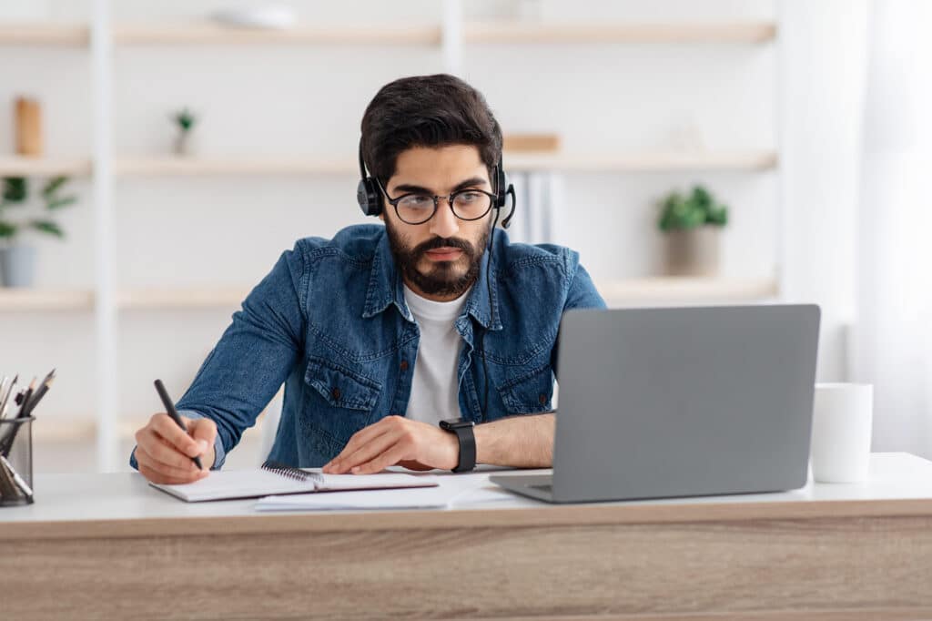 IT services expert helping a client over the phone