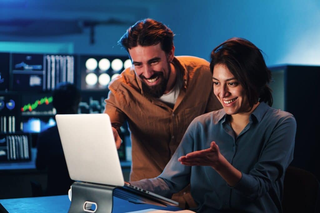 workers in the office using managed cloud solutions to complete tasks