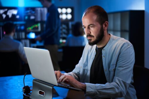 cybersecurity professional working on preventing cyber threats on computer