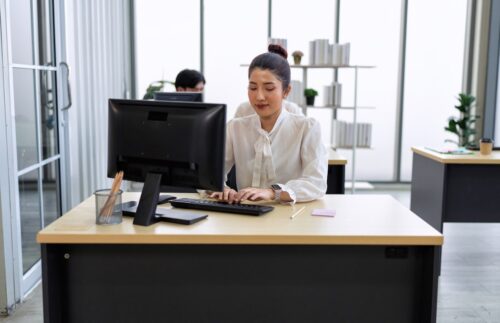 Employee working in office on computer